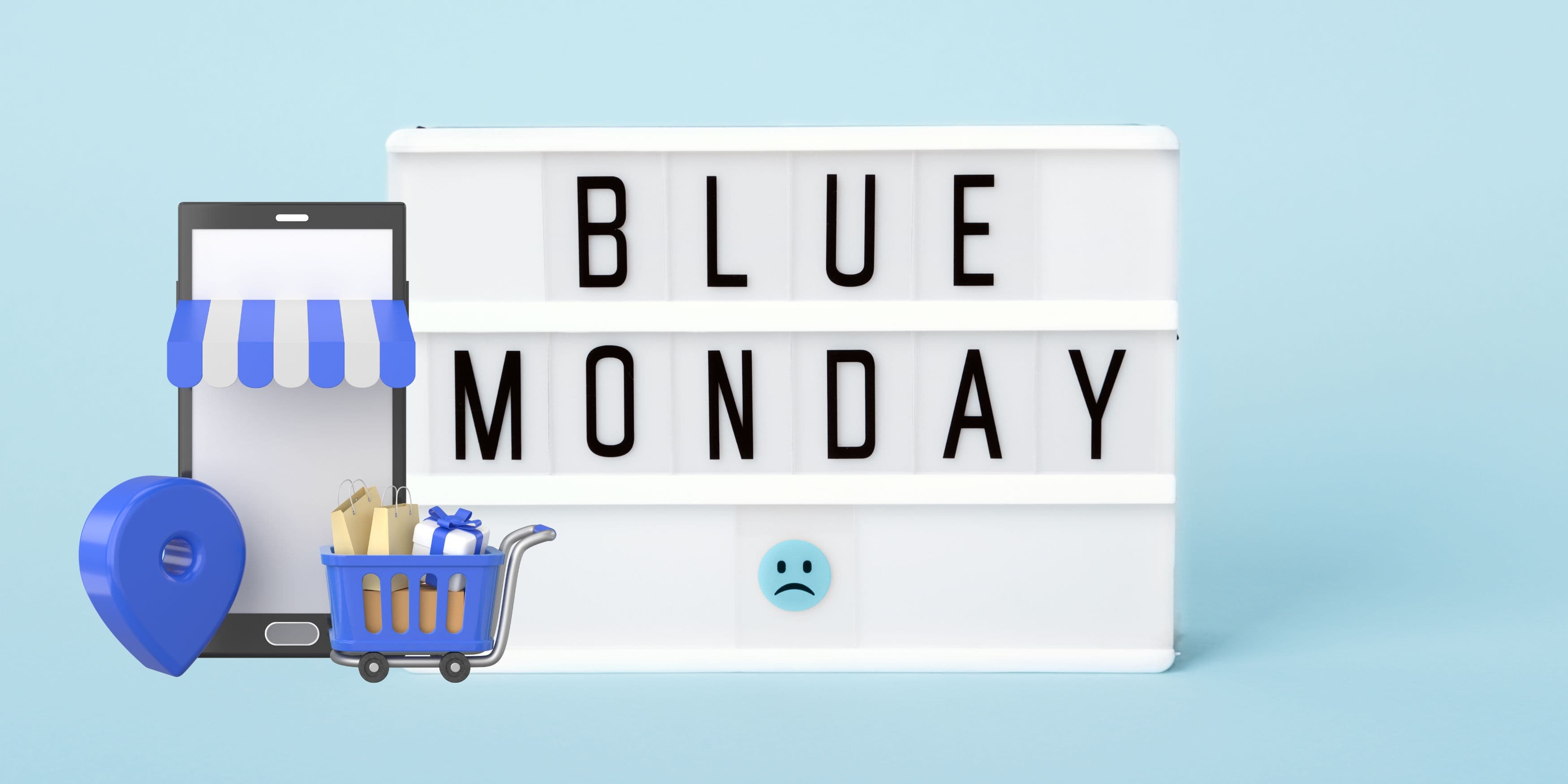 Una lavagna con la scritta 'Blue Monday', accompagnata da uno smartphone e un piccolo carrello della spesa, simbolo degli acquisti legati al Blue Monday.